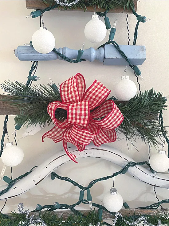 red and white gingham bow on tree