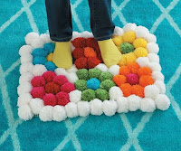 Alfombras DIY con pompons para el hogar