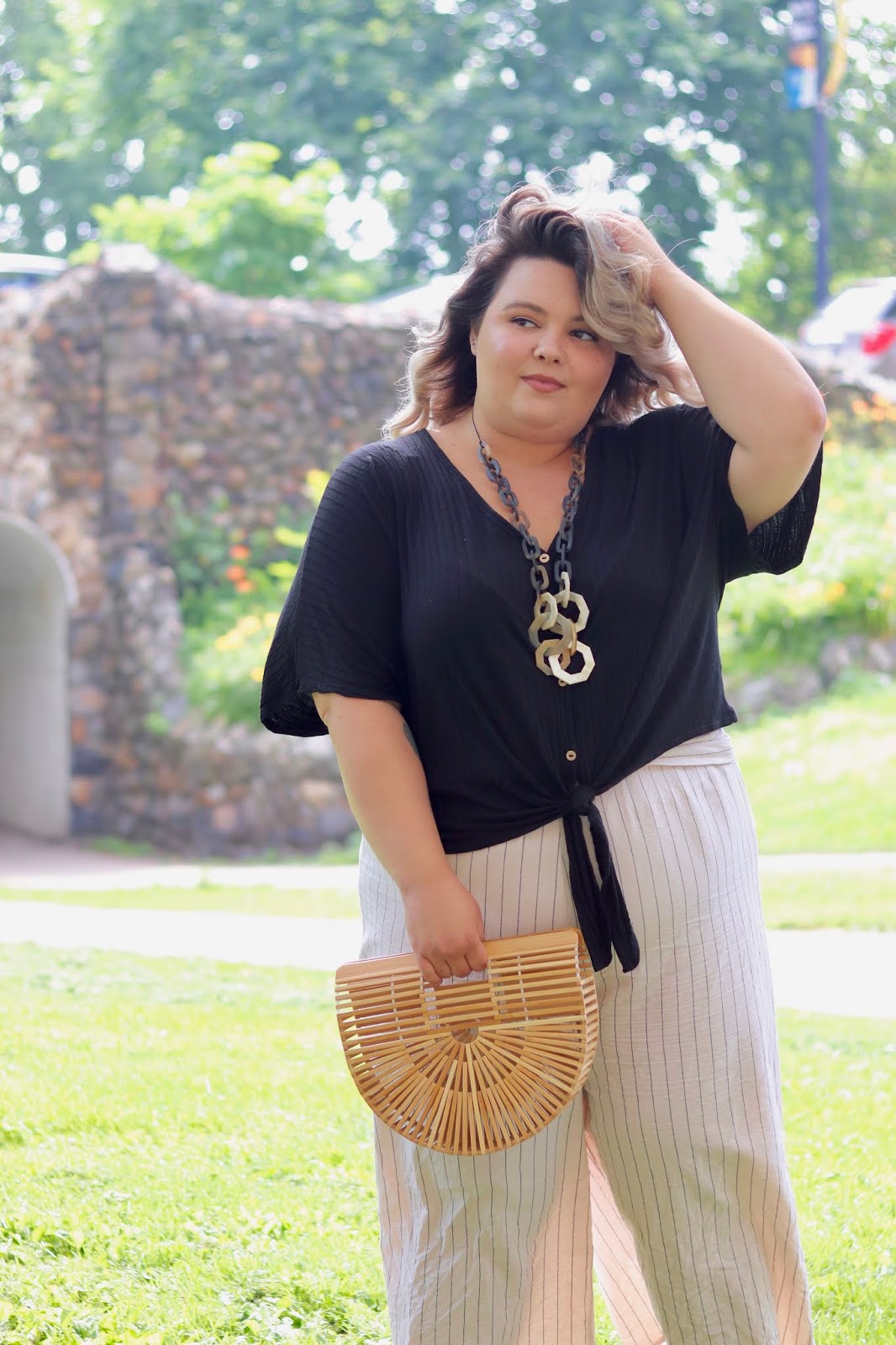 Chicago Plus Size Petite Fashion Blogger, influencer, YouTuber, and model Natalie Craig, of Natalie in the City, rocks crop tops from Gordmans, an off-price retailer, and embraces her insecurities.