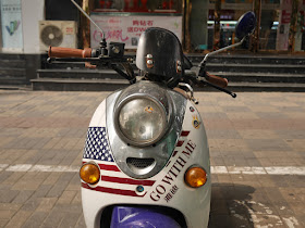 "Go With Me" US flag design on front of motor scooter