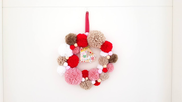 tutorial corona de navidad de pompones