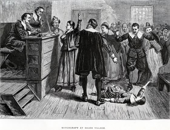 A generalized courtroom scene showing an "afflicted" girl fallen on the floor in front of the judges bench. An accused woman stands in front of the judges holding her right hand over her heart and gesturing upwards, as if in the act of declaring her innocence before God.