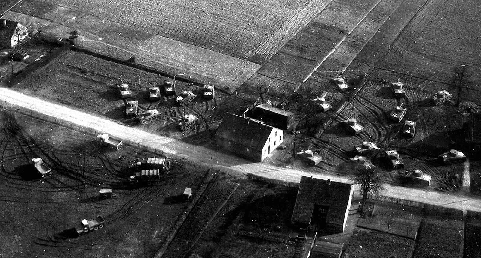 Inflatable dummy tanks and trucks set up near the Rhine River in Germany. Attention to detail was critical. Bulldozers were used to make tank tracks leading up to where the 93 lb (42 kg) inflatable dummies stood. Real artillery shells were tossed around fake guns.