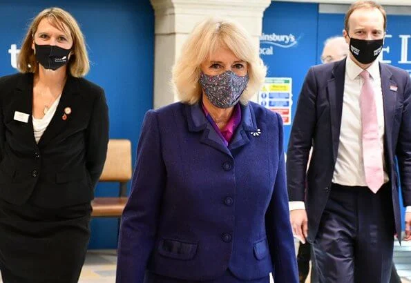 Duchess of Cornwall visited Paddington Station to watch a demonstration by the charity Medical Detection Dogs. blue navy blazer