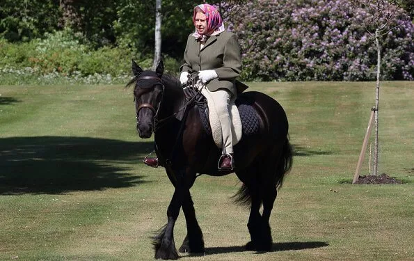 Queen Elizabeth riding one of her ponies called Balmoral Fern, a 14-year-old fell pony, at Windsor Home Park in Windsor Castle