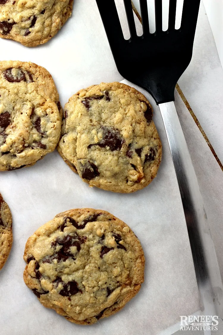 DoubleTree Chocolate Chip Cookies on baking sheet cooling with spatula