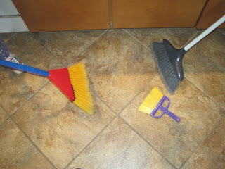Three different-sized sweeping brushes