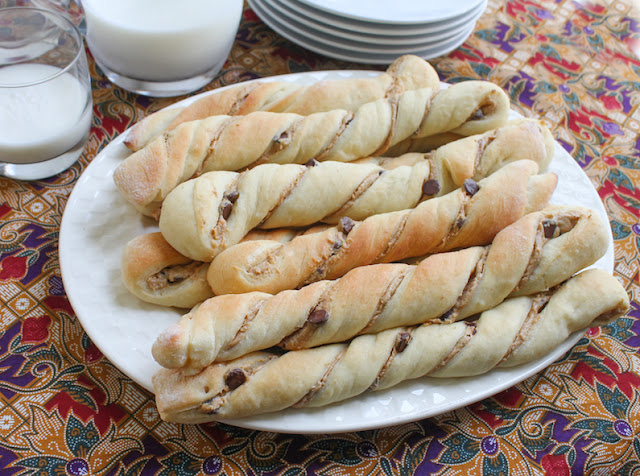 Food Lust People Love: These Peanut Butter Chocolate Chip Twists are made with an enriched brioche dough filled with peanut butter and chocolate chips and baked till golden. Enjoy them with a cold glass of milk or a cup of tea.