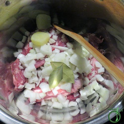 Morsels of Life - Pressure Cooker Mojo Pork Step 3 - Place pork, bay leaves, and onions in pressure cooker. I added the lime juice directly to the pressure cooker. You could do the same or add it to the mixture from Step 2.