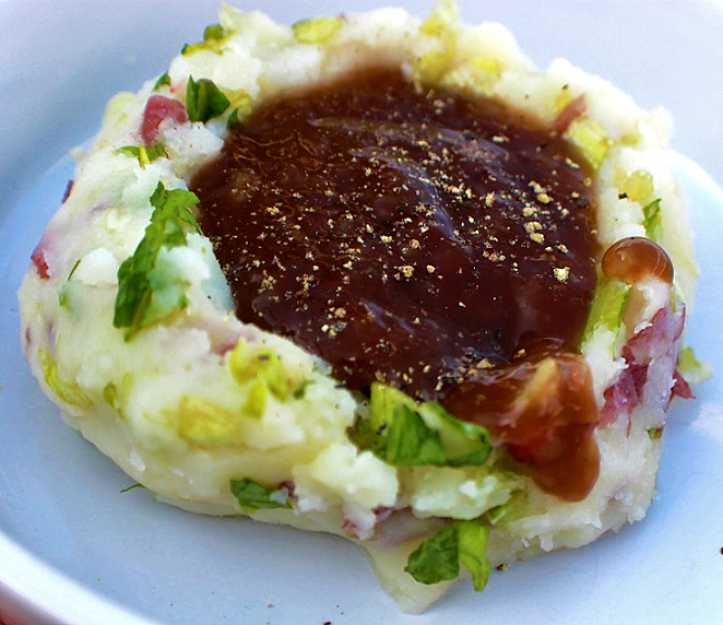 Colcannon Potatoes with Guinness Gravy this is a dish of colcannon potatoes with Irish Guinness beer gravy puddled in the middle