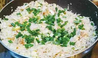 Poured green scallions (spring onions) over Chicken fried rice