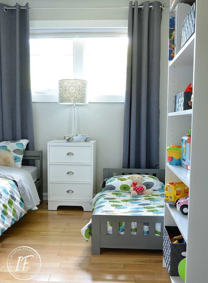 A shared kids guest room makeover for our grandkids on a budget. Grey painted walls, new furniture, and kids decor, plus DIY kids wall art ideas for under $400.