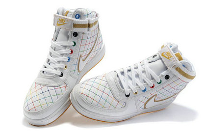 white and gold nike shoes