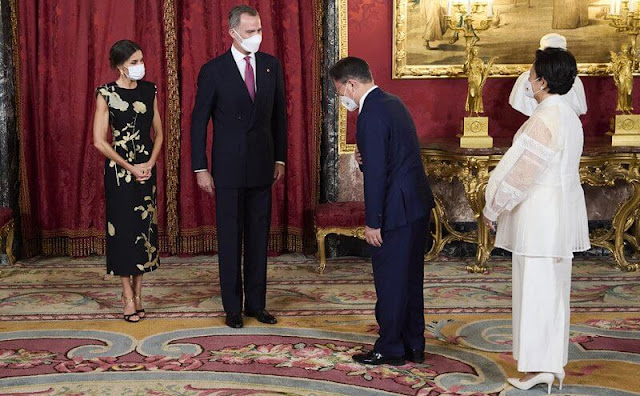 Queen Letizia wore a sequin embellished metallic floral print jacquard midi dress from Dries van Noten. First Lady Kim Jung-sook