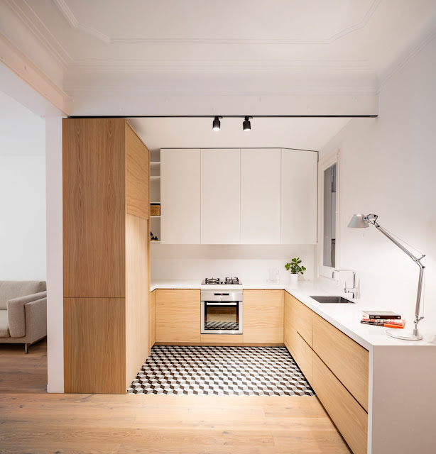 L shaped kitchen with corner window