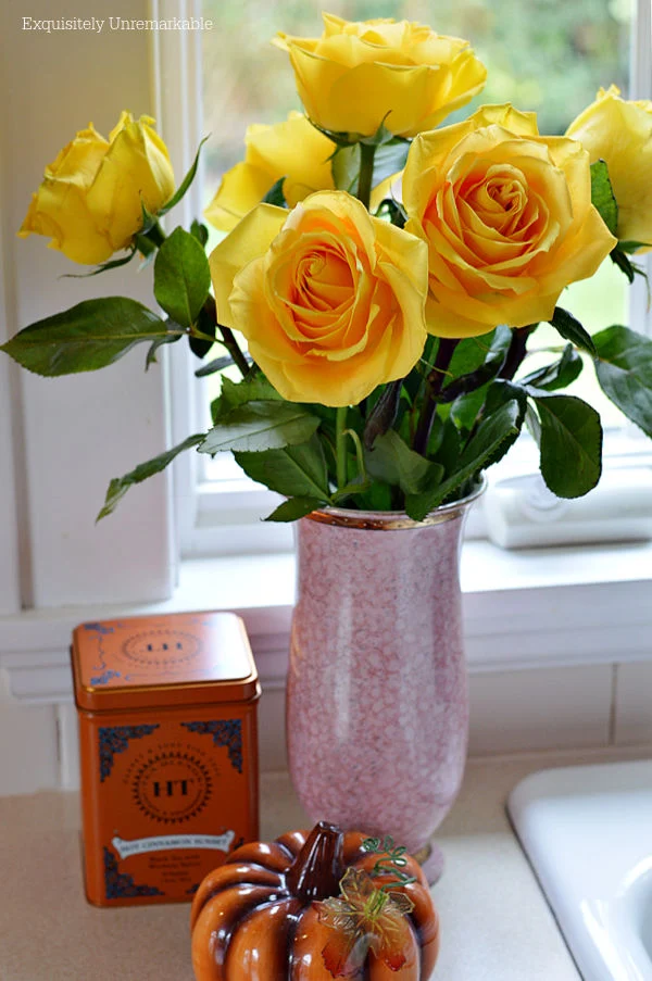 Yellow Roses In Fall with pumpkin on counter