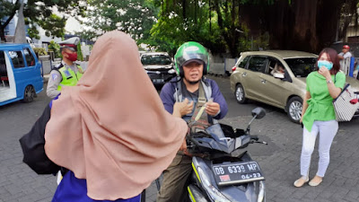 Polresta Manado bersama KNC Manado Gelar Aksi Bagi-bagi Masker Gratis
