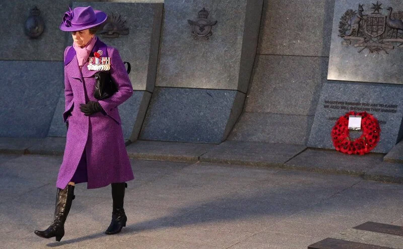 Princess Anne wore an eye-catching purple coat and matching hat, a pale lilac scarf and black knee-high boots