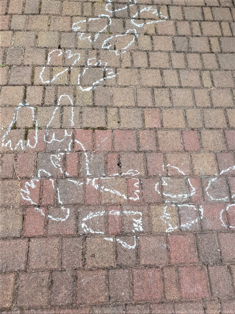 kids jumping on the marked spaces and counting 