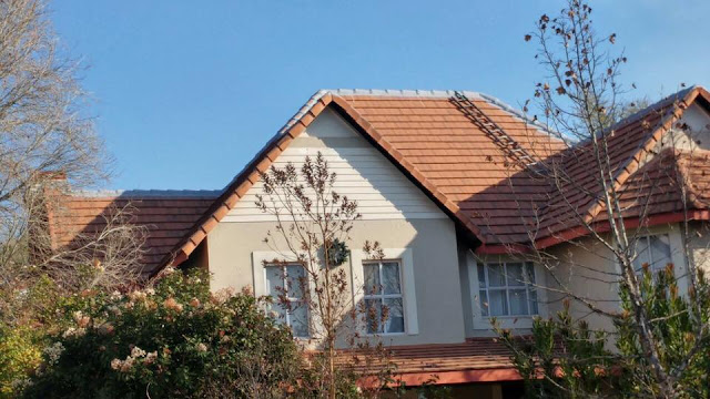 Roof repairs on a high pitch tile roof