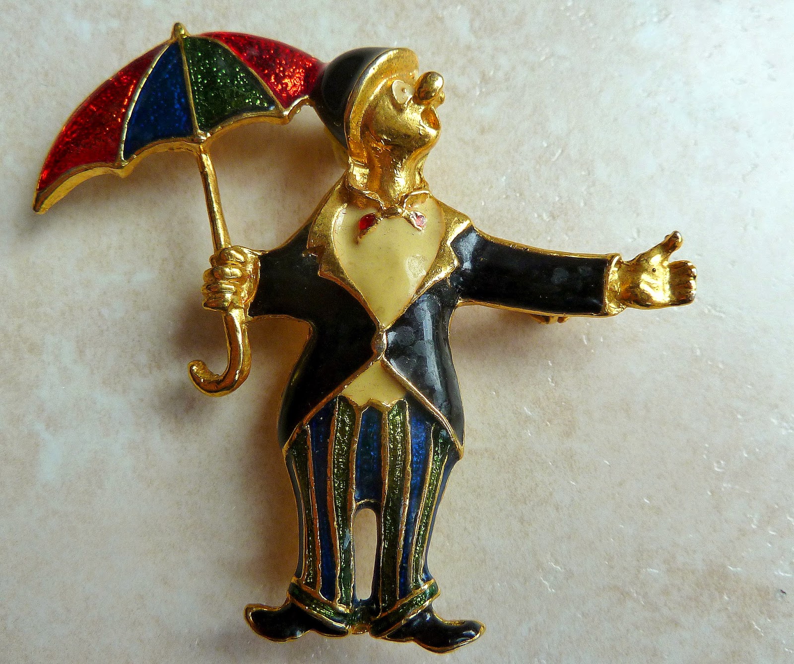 http://www.kcavintagegems.uk/vintage-clown-in-the-rain-brooch-132-p.asp