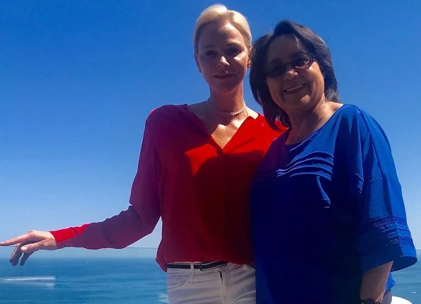 Princess Charlene met with Cape Town Mayor Patricia de Lille. Princess Charlene of Monaco Foundation. Princess Charlene wore red blouse