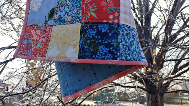 Simple patchwork baby quilt made with Rifle Paper Co. fabric from Cotton + Steel