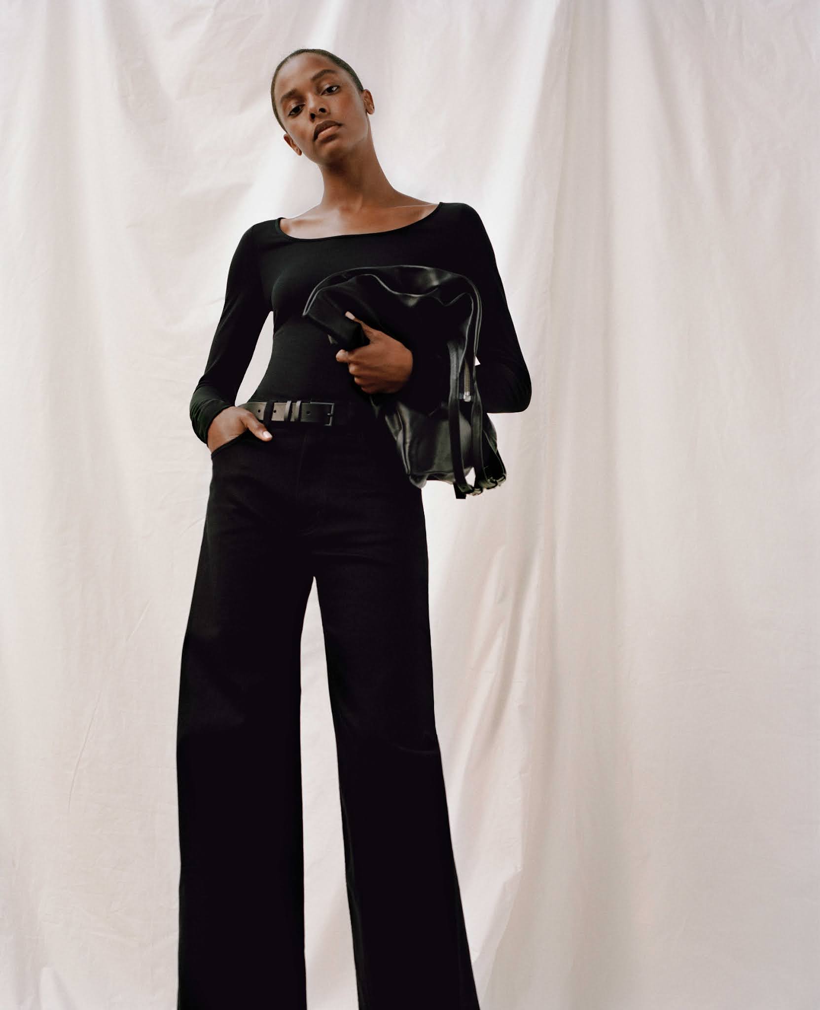 5 Minimalist Fall Outfit Ideas — Capsule Wardrobe with black boatneck top and wide-leg jeans