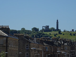View from bridge up Leith Walk to Calton Hill - view of rows of tenement houses up to a hill with monuments on it.  Photo by Kevin Nosferatu for the Skulferatu Project