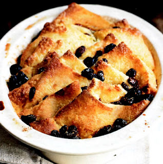 Bread and Butter Pudding. Classic dessert of bread and raisins cooked in custard base in a pudding dish.