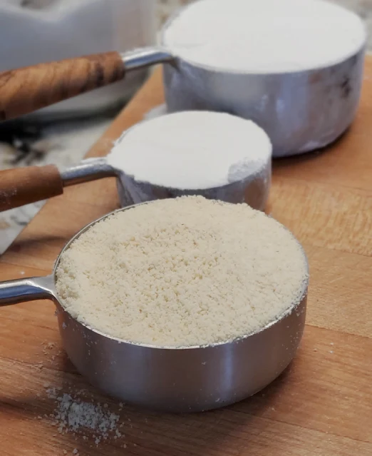 measuring cups full of flour