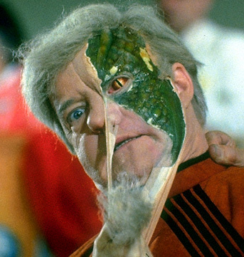 Alien Explorations: V's Visitors with reptilian faces behind human masks  (1983)