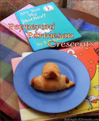 Pepperoni Parmesan Crescents are a quick snack for an afternoon with a book, or just as easily served as an appetizer. | Recipe developed by www.BakingInATornado.com | #recipe #snack