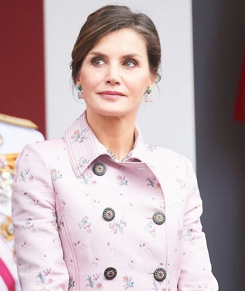 Queen Letizia wore Carolina Herrera Coat and Queen Letizia Jewels Coolook Sarin Earrings, she wore Magrit pups and carried clutch at Armed Forces Day