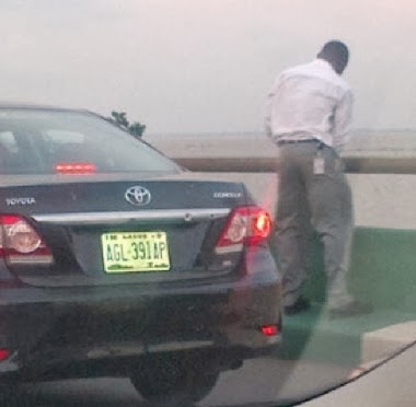 man urinating third mainland bridge