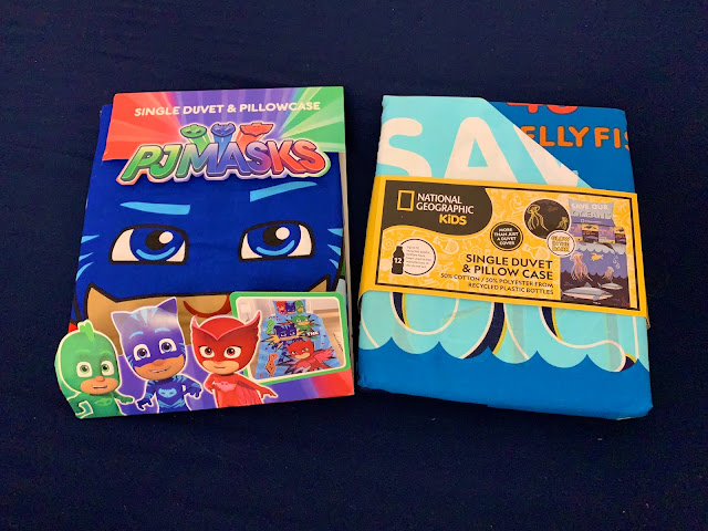 The Dreamtex PJ Masks and National Geographic kids bedding in packaging.