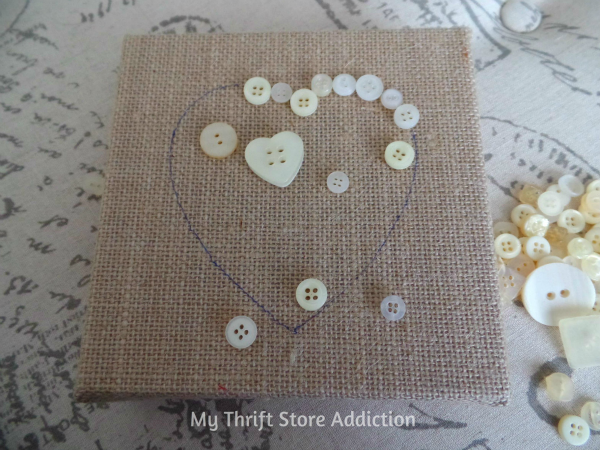 Buttons and Burlap Heart in 3 Easy Steps mythriftstoreaddiction.blogspot.com Simple project created with clearance buttons and burlap sign!