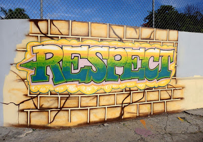 Airbrushed mural on wall saying the word "Respect".