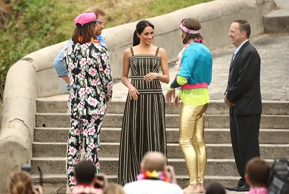 Meghan Markle wore Martin Grant Pleated Stripe Long Dress. The Duke and Duchess of Sussex visited Bondi Beach