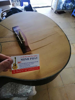 Địa chỉ thay dây đàn, chỉnh rè, dán thùng đàn guitar tphcm