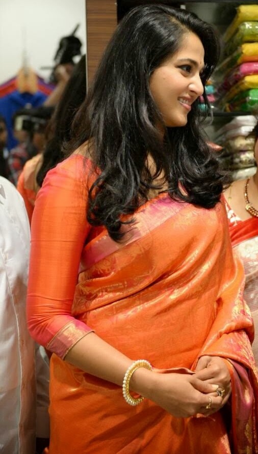 Anushka Shetty Photos In Orange Saree