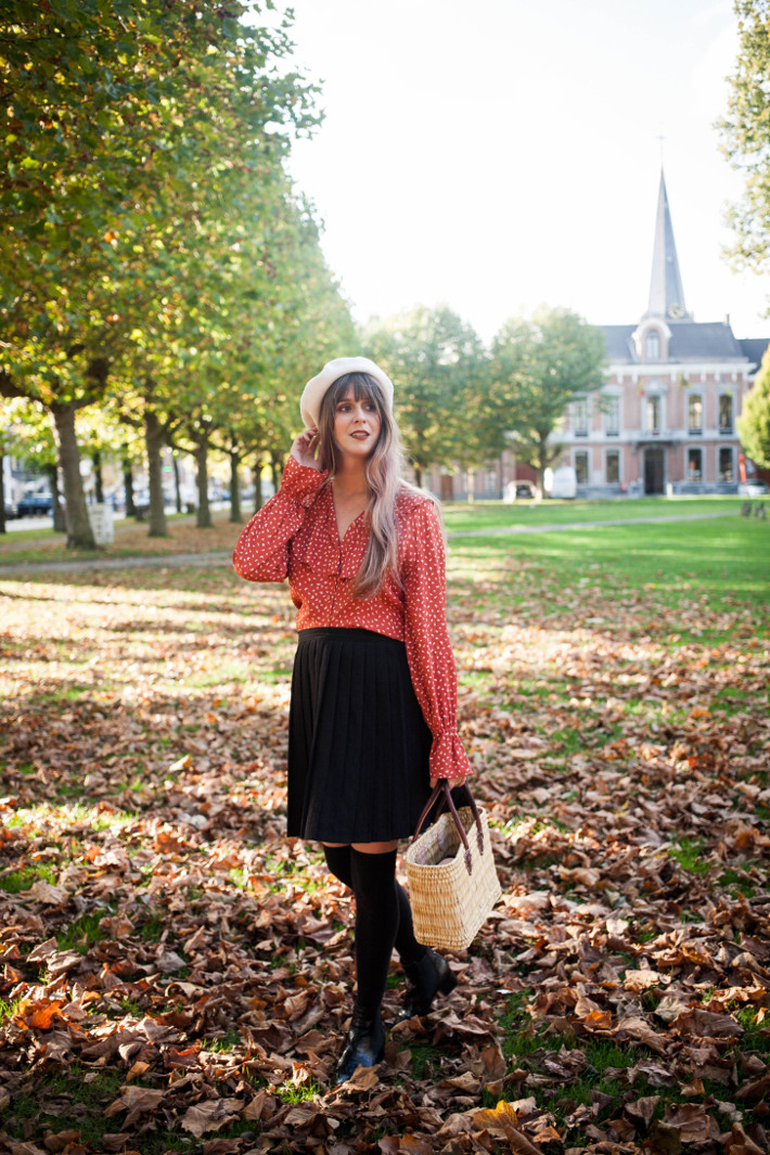vintage fall outfit in ruffled blouse, knife pleated skirt and overknee socks