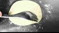 Pricking a pakwan dough for dal pakwan recipe