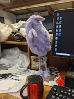 Fluffy Purple Chicken, metal mocha mug, desk clutter