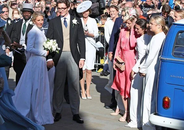 Princess Eugenie wore Peter Pilotto floral print dress. Princess Beatrice wore The Wampire's Wife leaf print midi dress