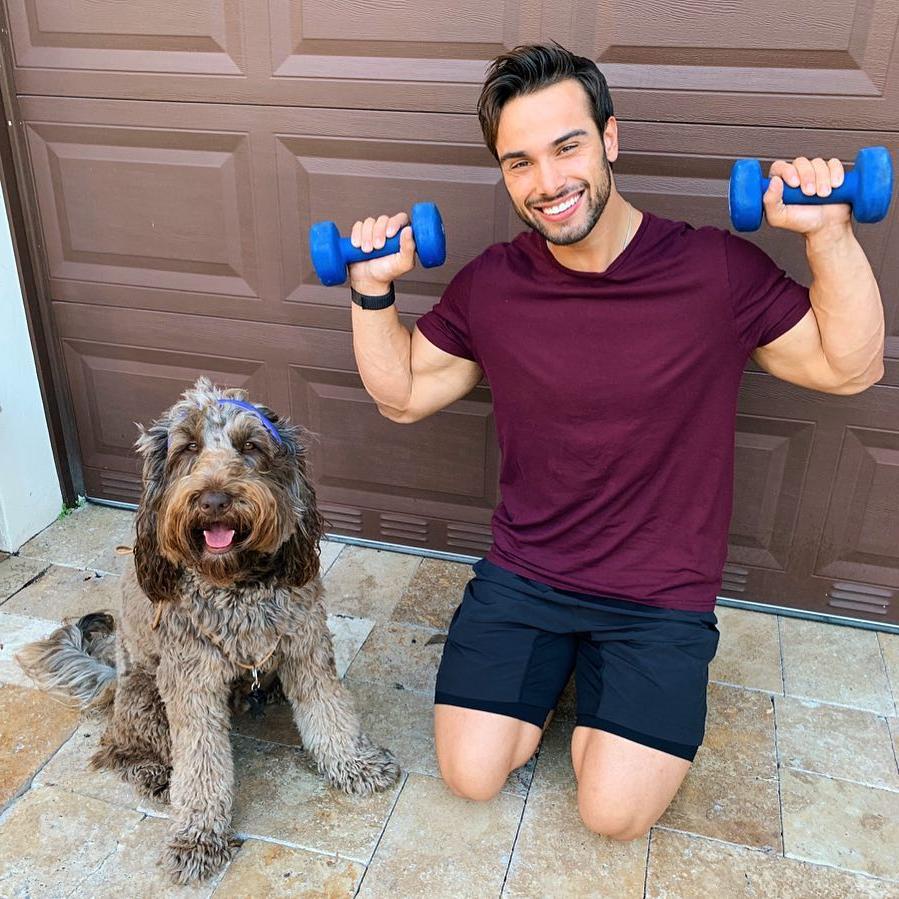 cute-dog-owner-smiling-lifting-baby-weights-gay-bottom-dude