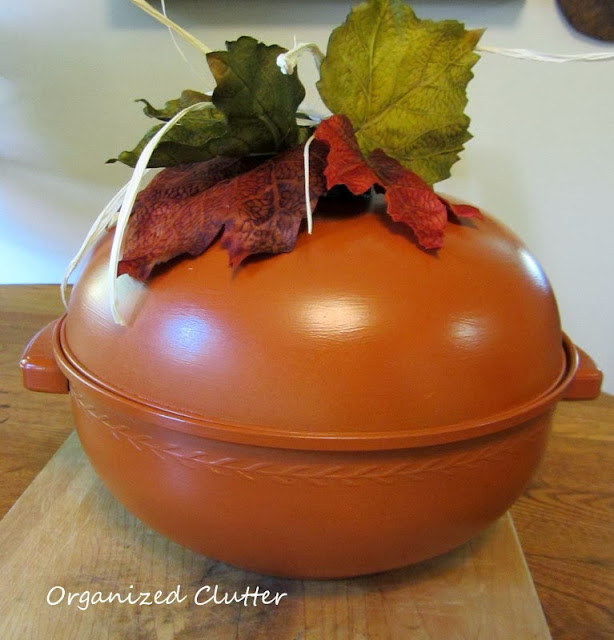 Repurposing a vintage bun warmer into a pumpkin http://organizedclutterqueen.blogspot.com/2013/10/vintage-bun-warmer-re-purposed-as.html