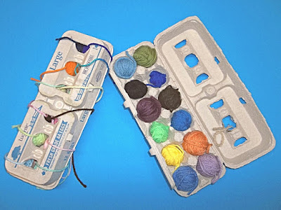 Small balls of yarn stored in egg cartons