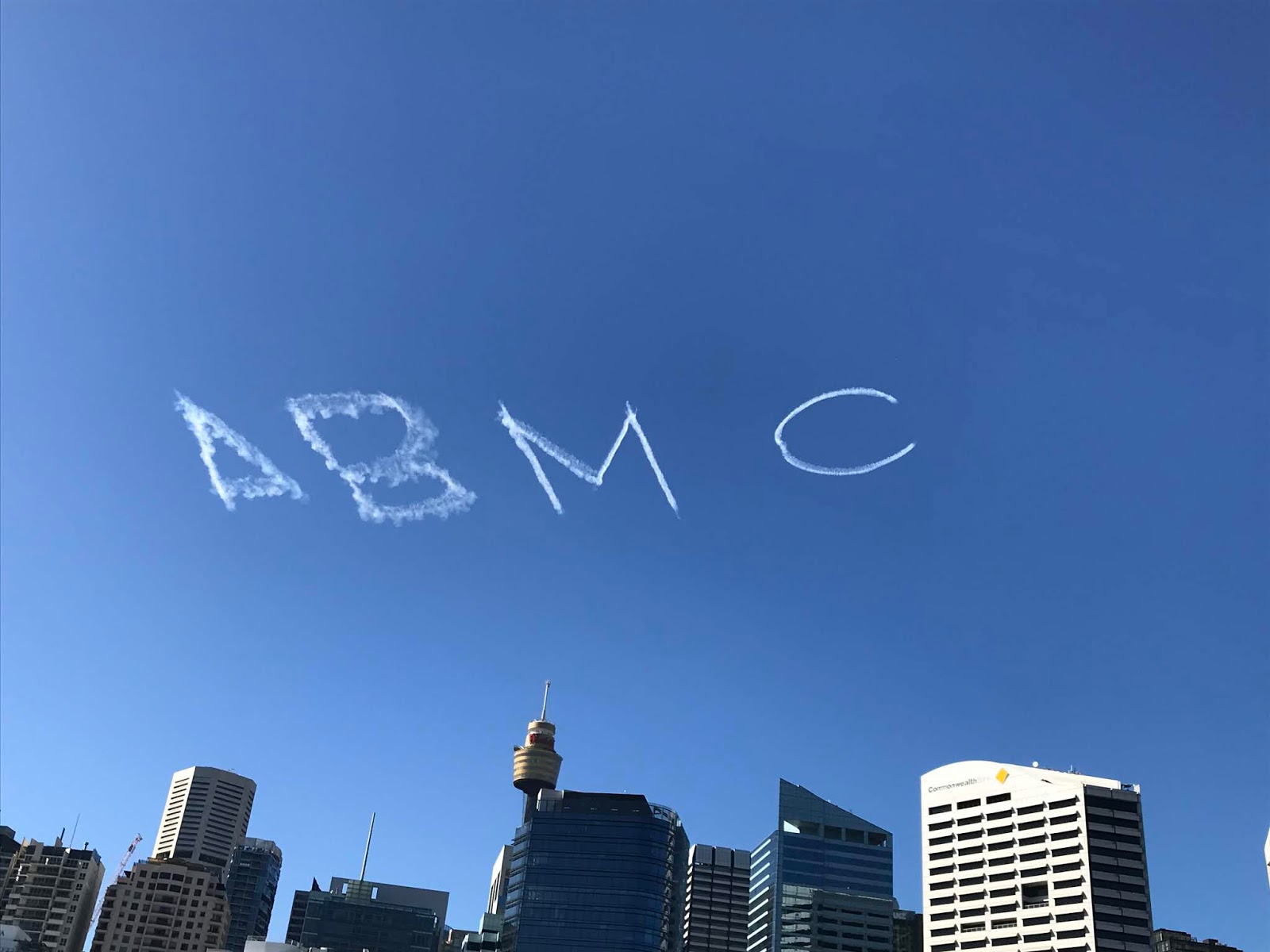 Happy Antipodean 'ABM6' Skywriting over Sydney CBD