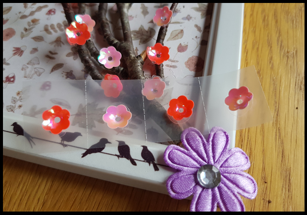 using Bostik glue dots to stick flower sequins to a twig